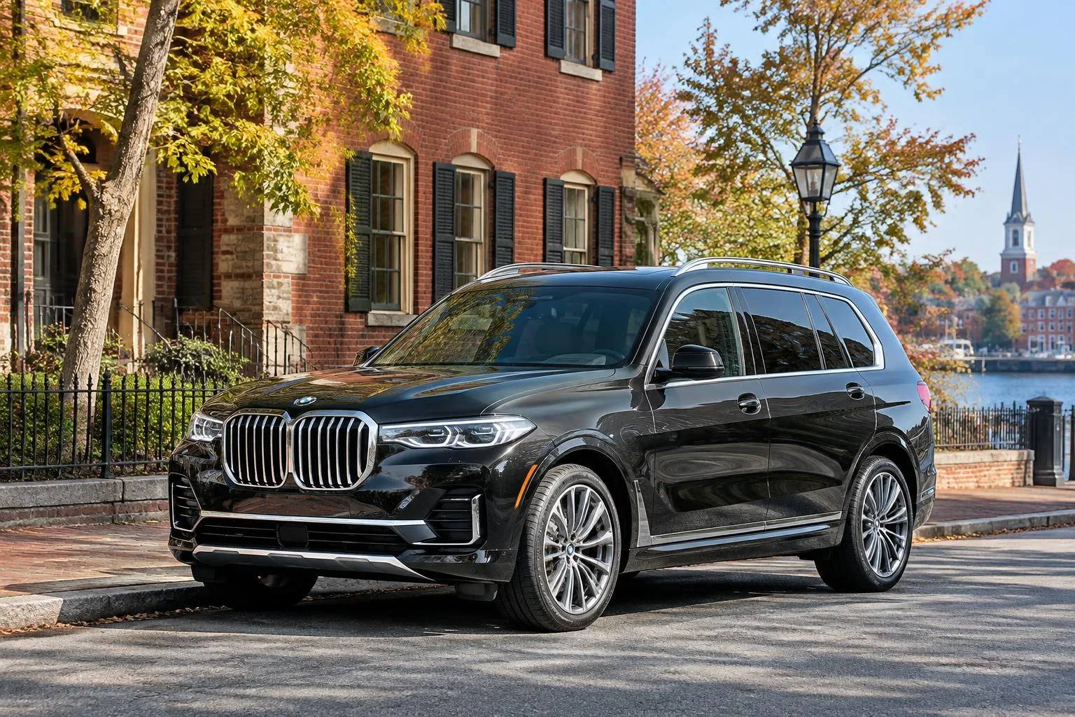 Black luxury SUV beside historic brick buildings, illustrating a private Logan Airport to Salem transfer